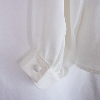 Anne Kriste vintage white sheer blouse with pearl beading on front and long sleeves with button cuffs hanging on hanger image 7