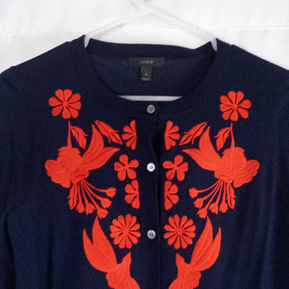 J Crew navy blue cardigan sweater with red embroidered floral design on front, button closure, long sleeves, and crew neck. image 2