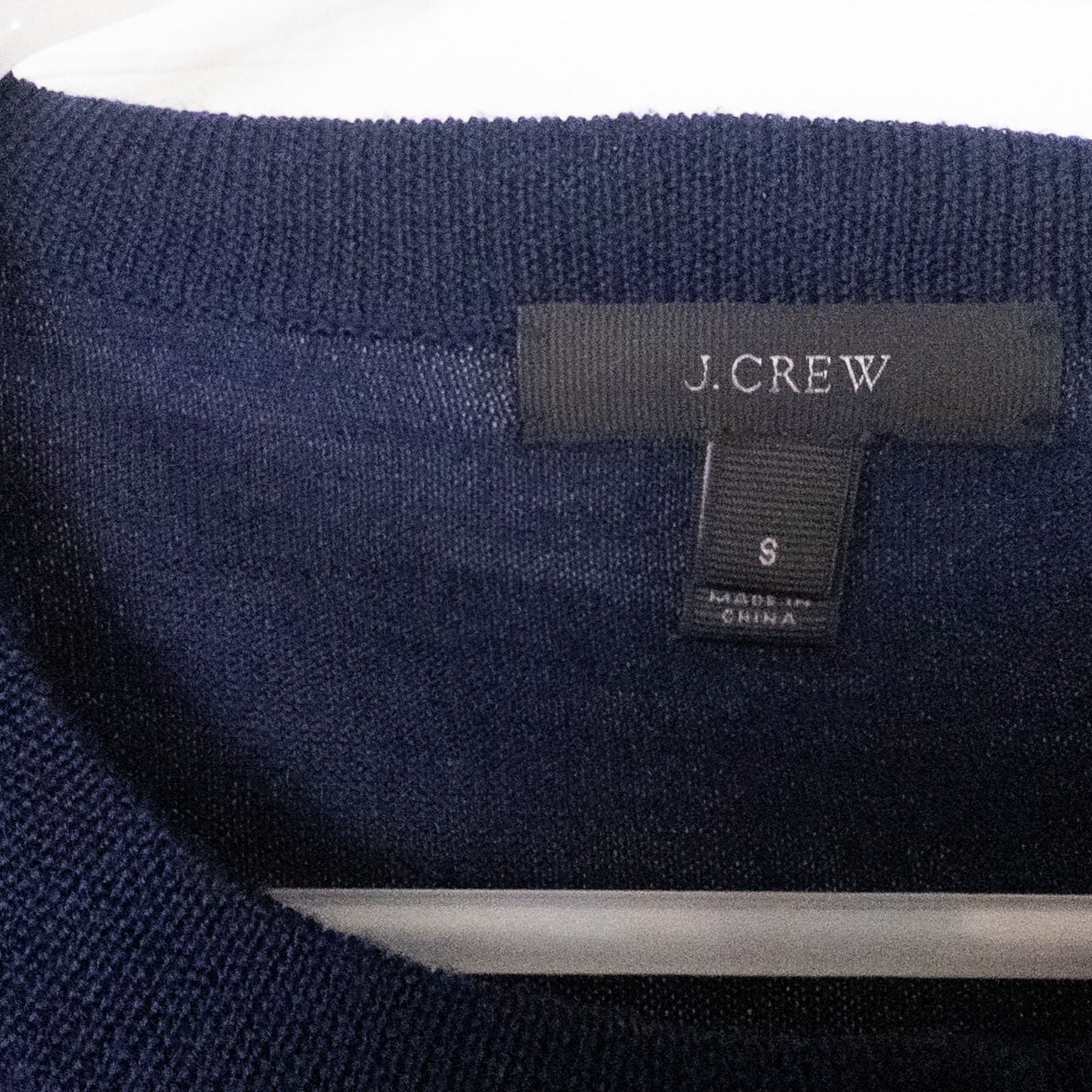 J Crew navy blue cardigan sweater with red embroidered floral design on front, button closure, long sleeves, and crew neck. image 6