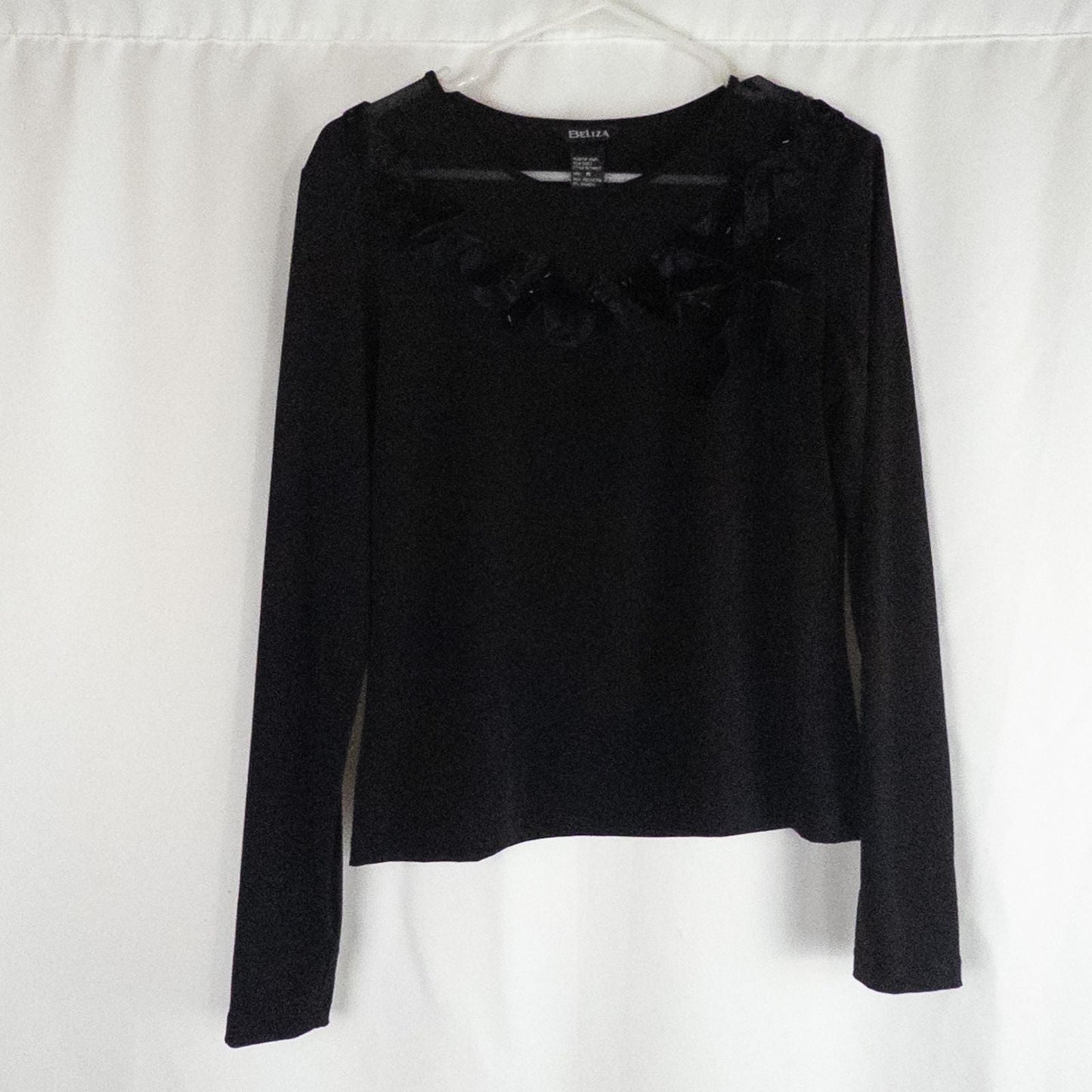 Beliza black velvet womens medium top with long sleeves and decorative velvet ribbon and bead trim at neckline on white hanger