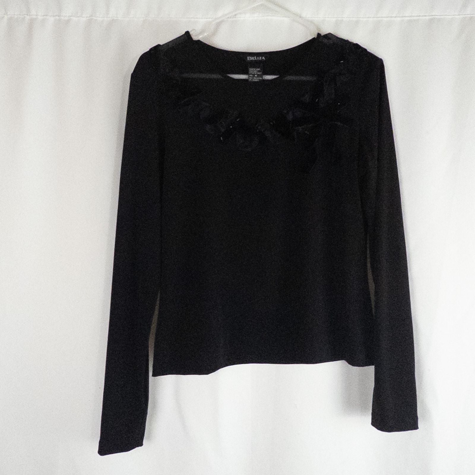 Beliza black velvet womens medium top with long sleeves and decorative velvet ribbon and bead trim at neckline on white hanger