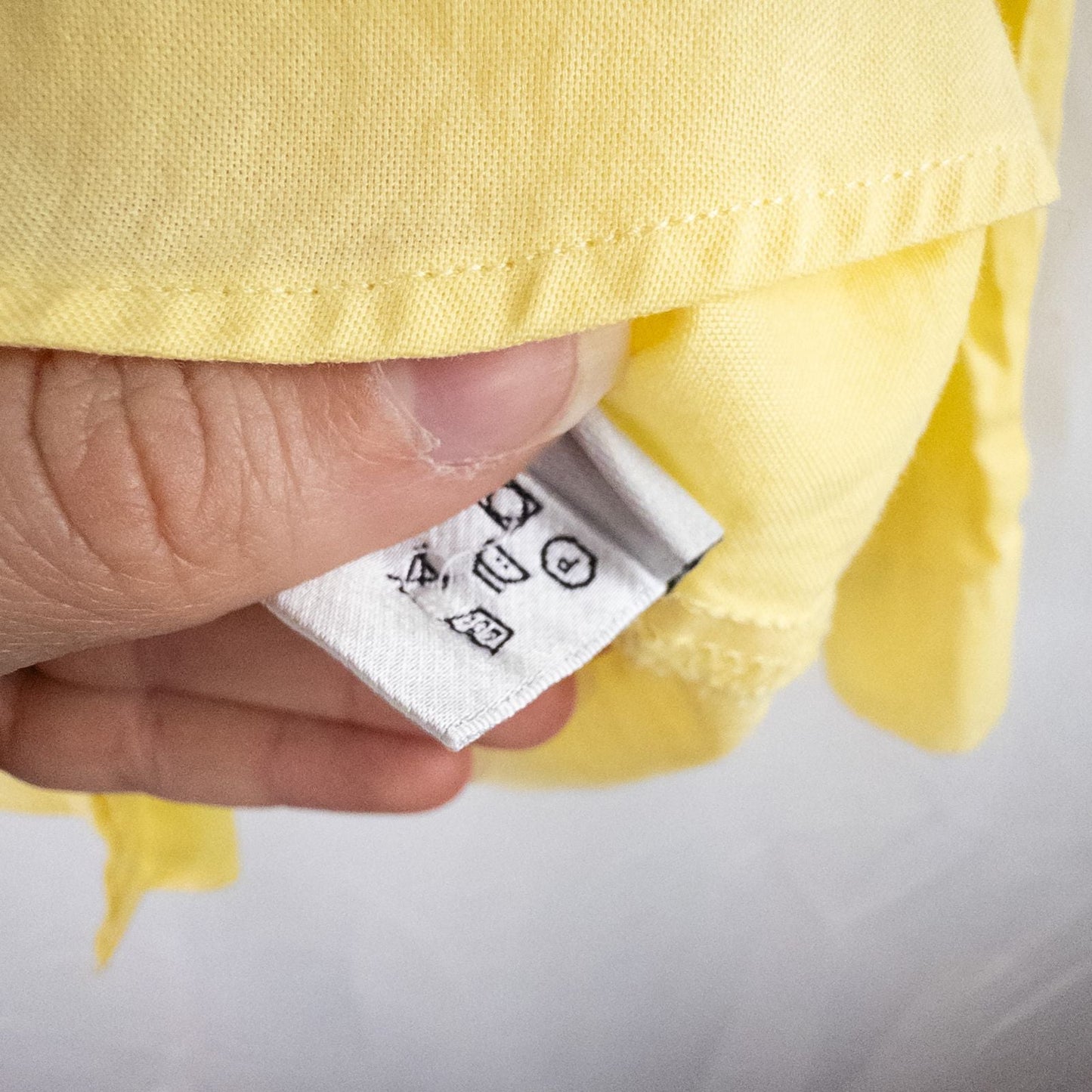 Pastel yellow Barbour original oxford long sleeve shirt laid flat showing front, collar, cuffs and back views image 13