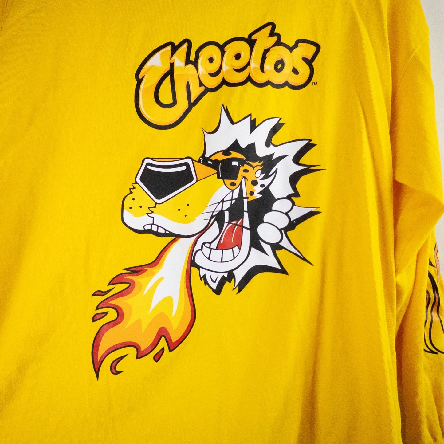 Yellow long sleeve shirt with Cheetos flame-breathing mascot graphic on front and flaming hot text on back image 2