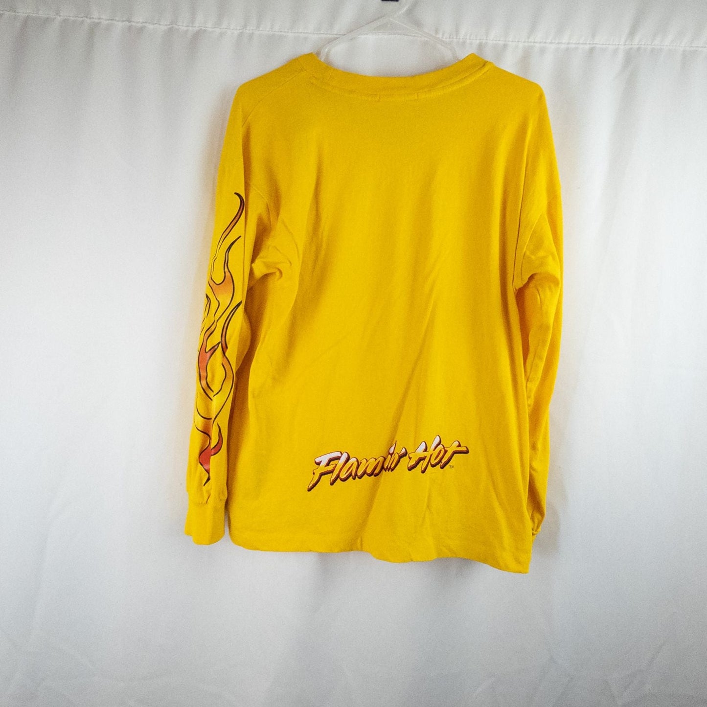 Yellow long sleeve shirt with Cheetos flame-breathing mascot graphic on front and flaming hot text on back image 5