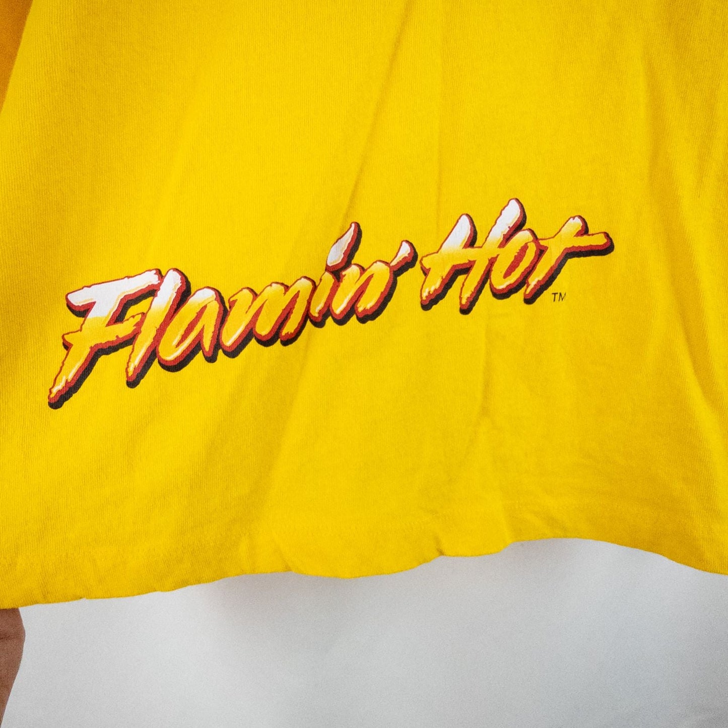 Yellow long sleeve shirt with Cheetos flame-breathing mascot graphic on front and flaming hot text on back image 6