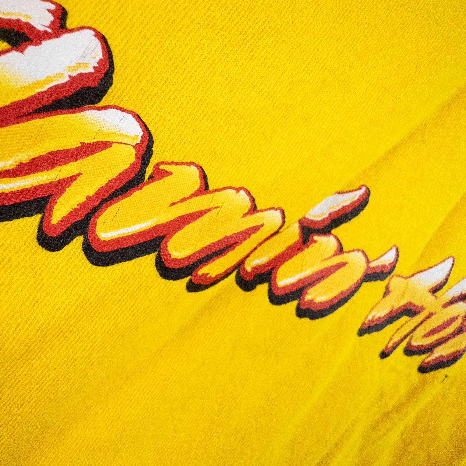 Yellow long sleeve shirt with Cheetos flame-breathing mascot graphic on front and flaming hot text on back image 7