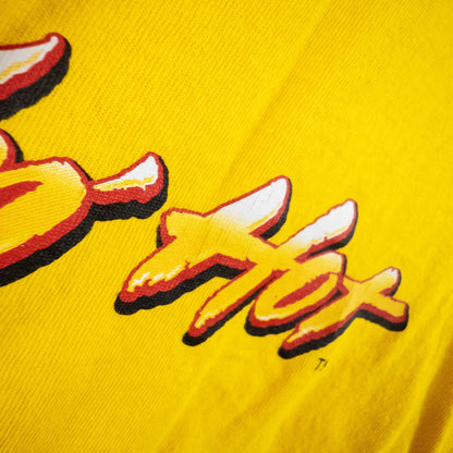 Yellow long sleeve shirt with Cheetos flame-breathing mascot graphic on front and flaming hot text on back image 8