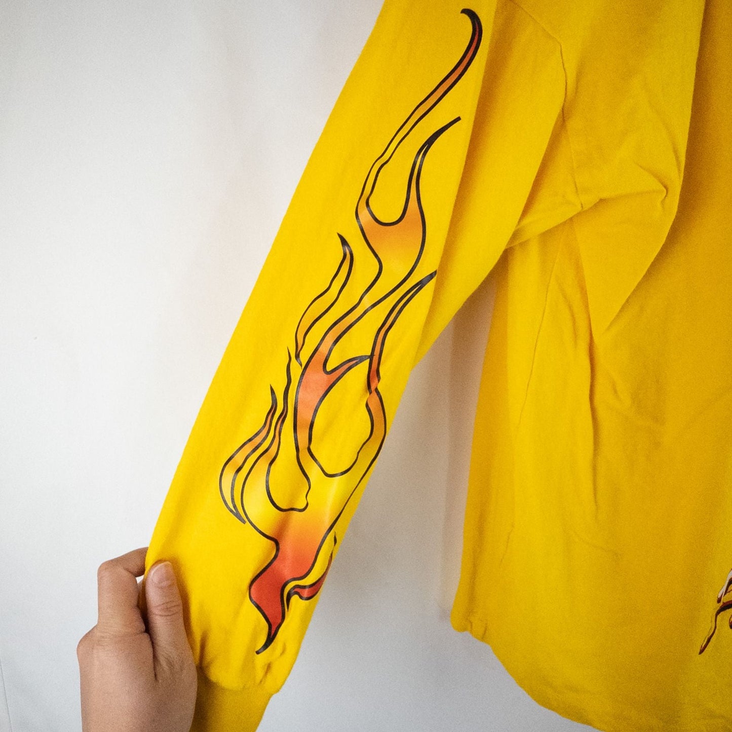 Yellow long sleeve shirt with Cheetos flame-breathing mascot graphic on front and flaming hot text on back image 9