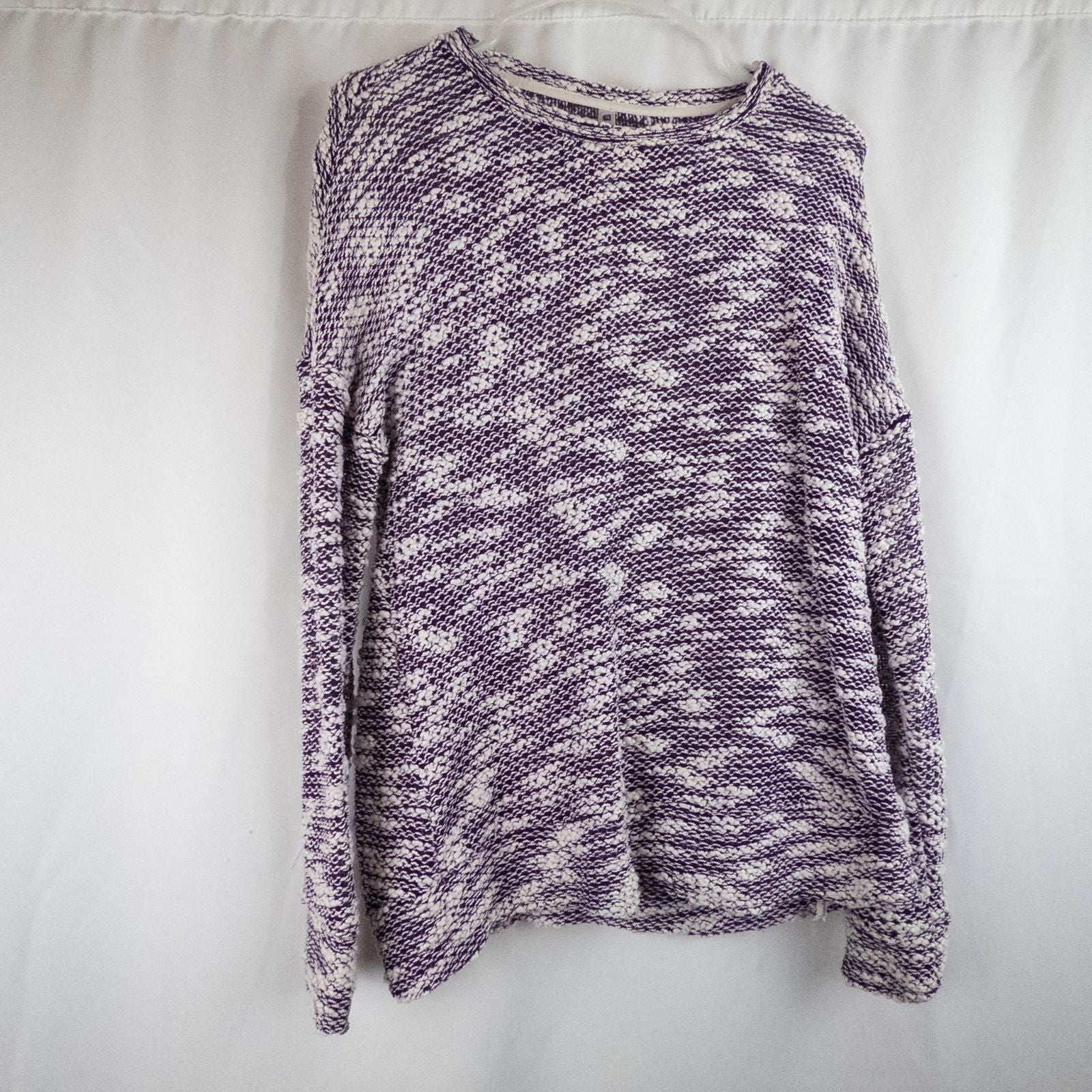 Purple and white striped open knit Fabletics sweater with textured yarn and relaxed oversized fit, shown front and close-up of knit texture and minor snags