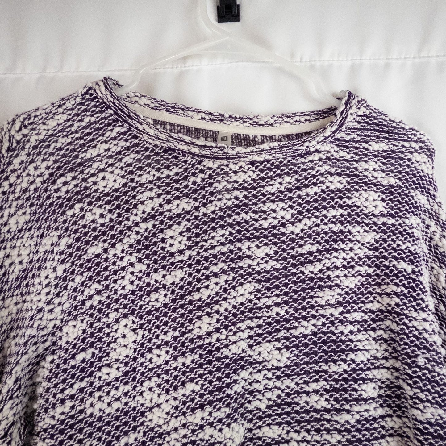 Purple and white striped open knit Fabletics sweater with textured yarn and relaxed oversized fit, shown front and close-up of knit texture and minor snags image 2