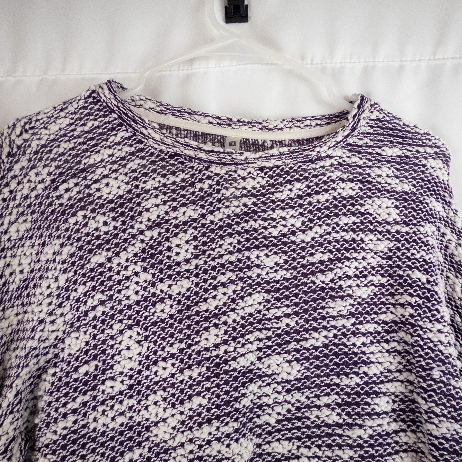 Purple and white striped open knit Fabletics sweater with textured yarn and relaxed oversized fit, shown front and close-up of knit texture and minor snags image 2