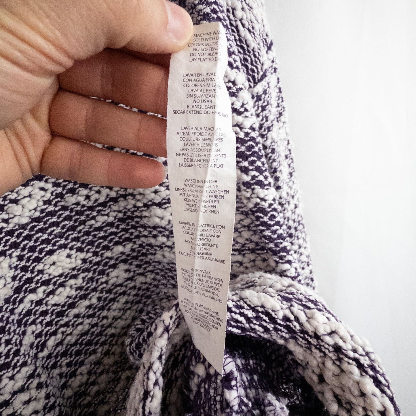 Purple and white striped open knit Fabletics sweater with textured yarn and relaxed oversized fit, shown front and close-up of knit texture and minor snags image 11