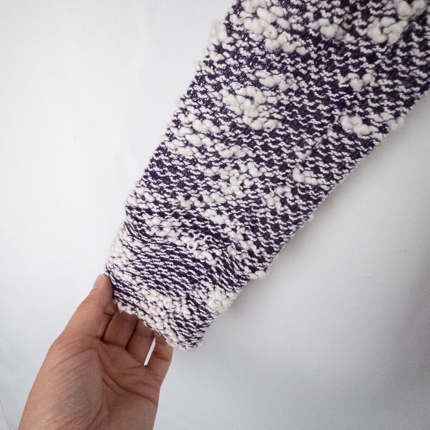 Purple and white striped open knit Fabletics sweater with textured yarn and relaxed oversized fit, shown front and close-up of knit texture and minor snags image 5