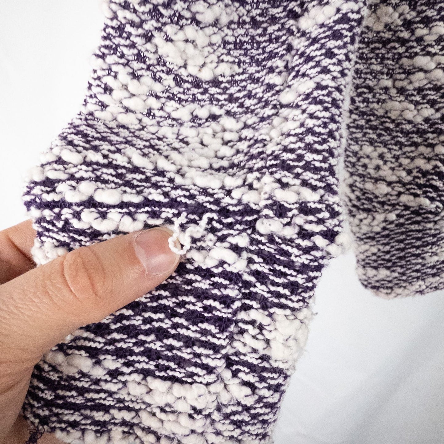 Purple and white striped open knit Fabletics sweater with textured yarn and relaxed oversized fit, shown front and close-up of knit texture and minor snags image 6