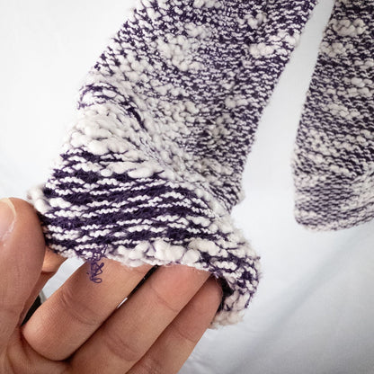 Purple and white striped open knit Fabletics sweater with textured yarn and relaxed oversized fit, shown front and close-up of knit texture and minor snags image 7