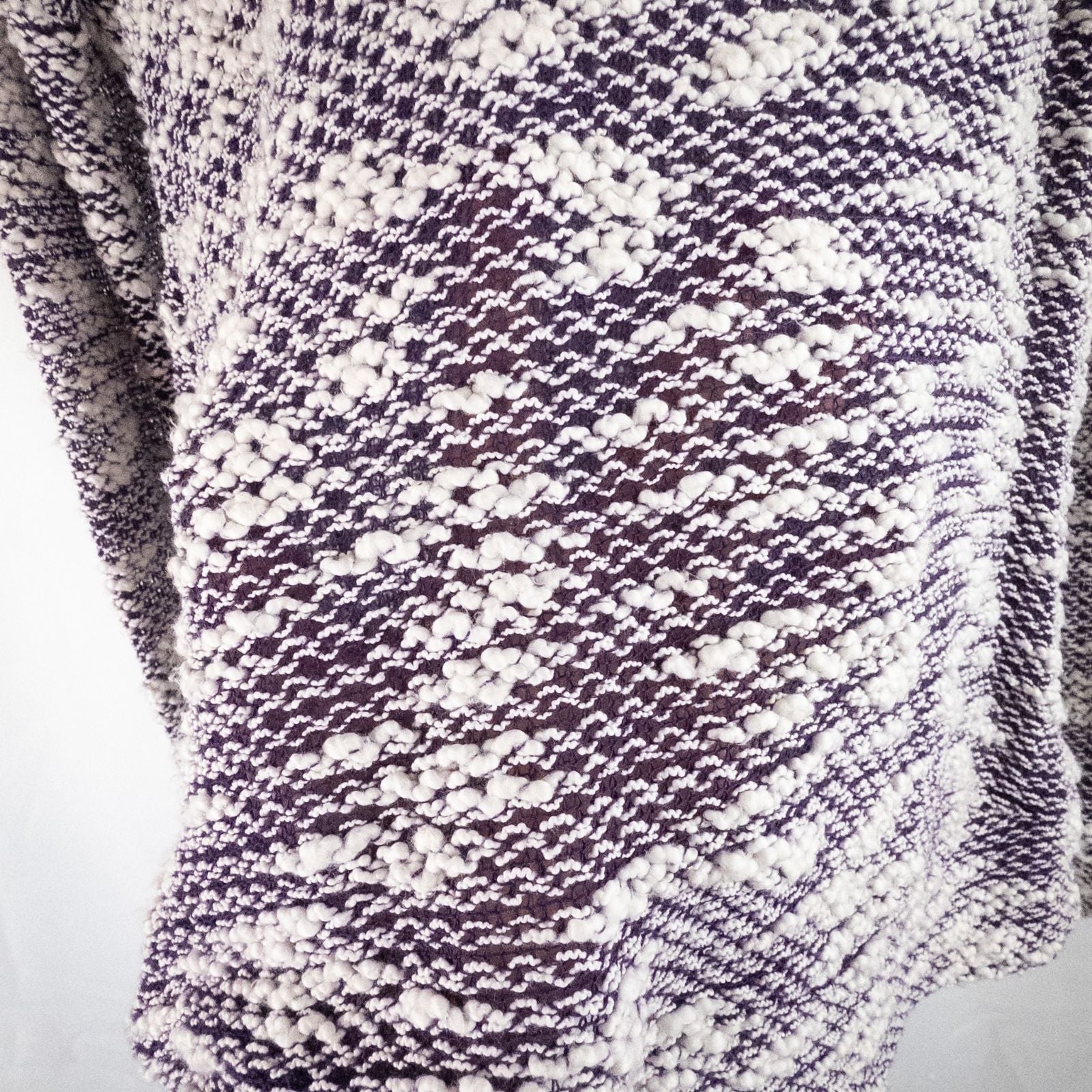 Purple and white striped open knit Fabletics sweater with textured yarn and relaxed oversized fit, shown front and close-up of knit texture and minor snags image 3