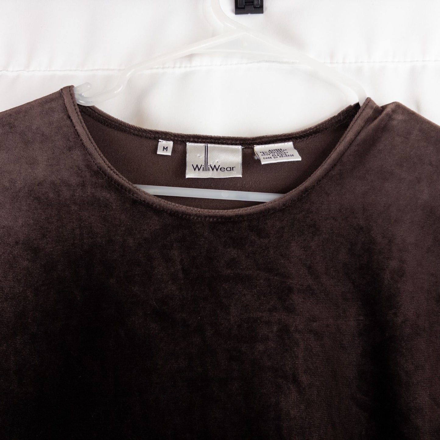 Williwear vintage brown velvet top with short sleeves and crew neckline hanging on a hanger image 2