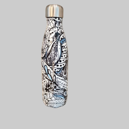 Starbucks Swizzle bottle with black white and blue artistic floral abstract print on countertop