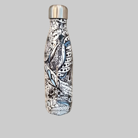 Starbucks Swizzle bottle with black white and blue artistic floral abstract print on countertop
