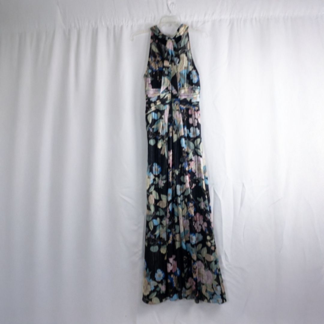 Adrianna Papell black floral maxi dress with twisted front detail hanging on clear hanger in front of white background image 5