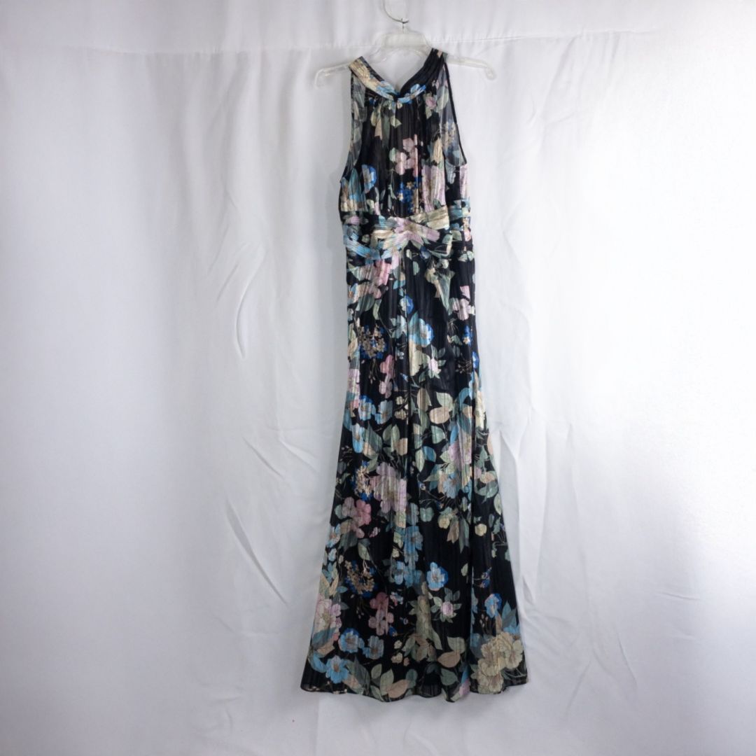 Adrianna Papell black floral maxi dress with twisted front detail hanging on clear hanger in front of white background