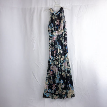 Adrianna Papell black floral maxi dress with twisted front detail hanging on clear hanger in front of white background