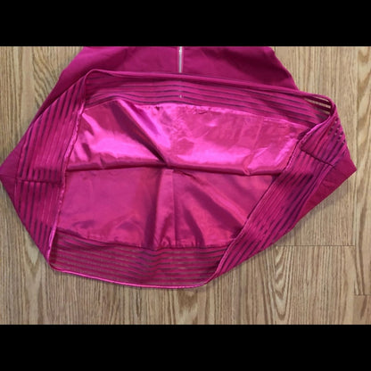 Pink sleeveless dress with sheer striped mesh panels on neckline and hem laid flat on wood floor image 7